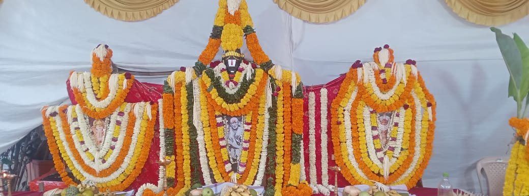 Altar of Sri Sai Baba decorated with flower garlands for the annual pooja
